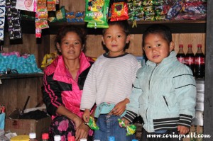 Family in shack shop, Yuksom/Yuksum, Sikkim, India