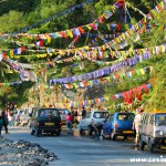 Flags, cars, people and car washing, Dussehra Hindu Festival, Gangtok, Sikkim, India