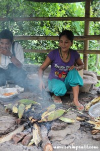 Lady cooking maize/corn, Sikkim, India