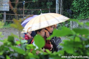 School children in the rain, Yuksom, Sikkim, India