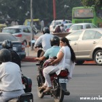 Roundabout, overloaded motorbike, baby, traffic, New Delhi